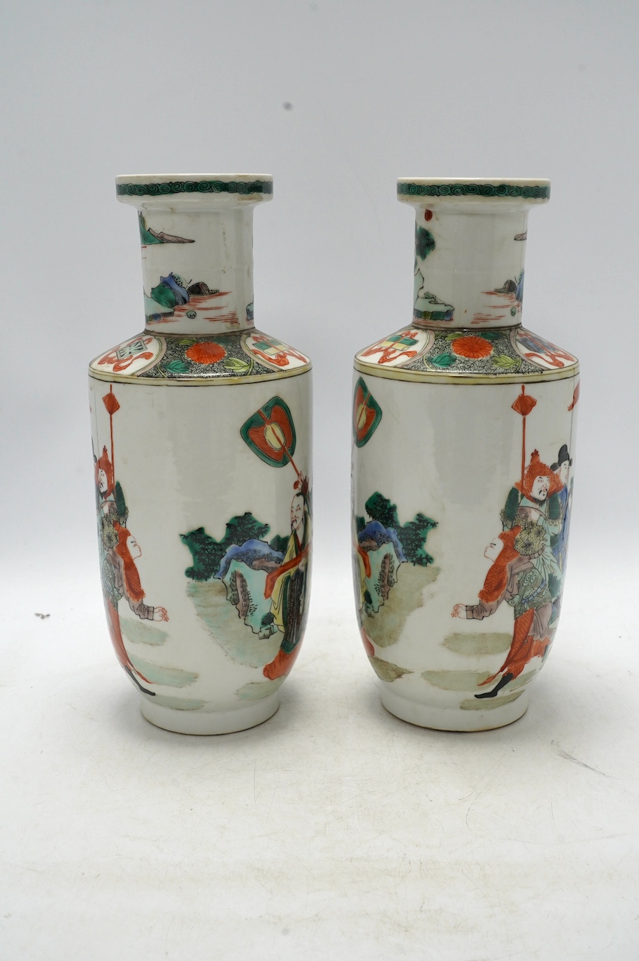 A pair of Chinese famille verte vases, painted with figures, 32cm high. Condition - good